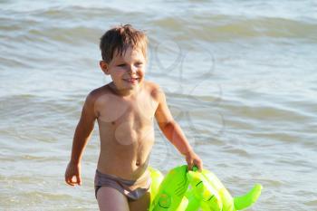 Royalty Free Photo of a Little Boy on a Beach