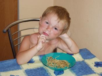 Royalty Free Photo of a Little Boy Eating