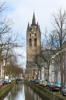 Canal and church tower in Delft, Netherlands