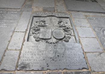 A plaque on the wall of the building, riddled with bullets. Delft,  Netherlands