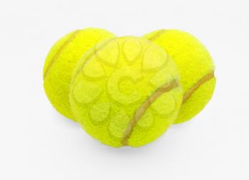 Three tennis balls on a white background