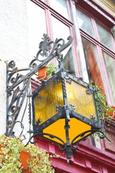 Lantern on the facade of old French house 