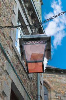 Lantern on the facade of old French house
