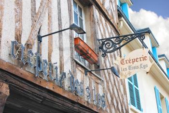A sign on the front of the house in Chartres, France