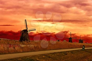 Windmill at sunset. Dutch landscape