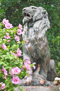 Statue of hunted lion in the city park