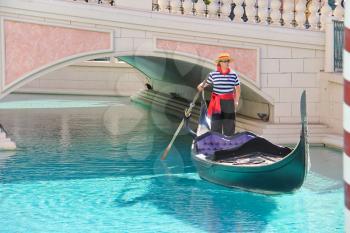 LAS VEGAS, NEVADA, USA - OCTOBER 20 : Gondolier in Venetian  Hotel on October 20, 2013 in Las Vegas, The resort opened on May 3, 1999. One of the most luxurious hotels in Las Vegas