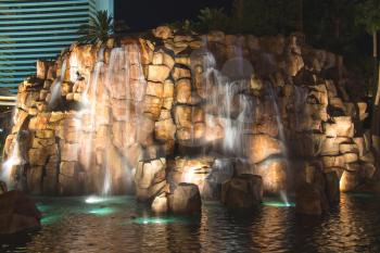 LAS VEGAS, NEVADA, USA - OCTOBER 23, 2013 : Waterfall at the Mirage hotel in Las Vegas, The Mirage hotel and casino is a 3,044 roomt .The casino has 100,000 square feet of gaming space 