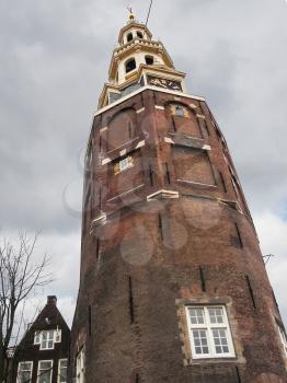 Montelbaans tower against a overcast sky .  Amsterdam . Netherlands