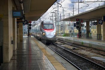  BOLOGNA, ITALY - MAY 03, 2014: The train arrives at  Bologna Station in  Italy