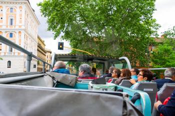 ROME, ITALY - MAY 03, 2014: Tourists visiting the attractions of the tour bus in Rome, Italy 