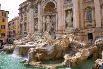 ROME, ITALY - MAY 04, 2014: Tourists near the Trevi Fountain in Rome, Italy