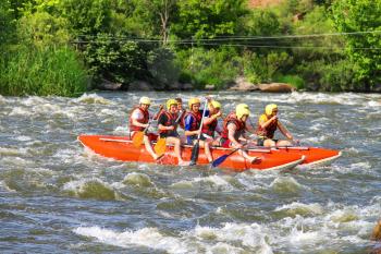 NIKOLAEV, VILLAGE GRUSHEVKA, UKRAINE - MAY 23, 2014: Rafting tourists with an experienced instructor on the river Southern Bug