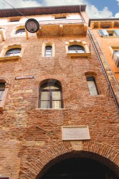 VERONA, ITALY - MAY 7, 2014: Memorial plaque on wall of the house Juliet in Verona, Italy 