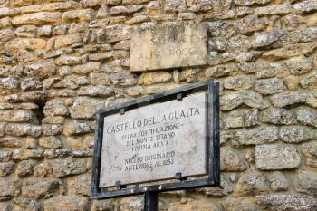 SAN MARINO. SAN MARINO REPUBLIC - AUGUST 08, 2014: Memorable plaque near the castle in San Marino. The text states: Castello della Guaita. first fortification of Mount Titan. original core prior to 12