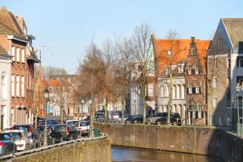 Den Bosch, Netherlands - January 17, 2015: Cars parking on canal embankment  in the Dutch town Den Bosch.
