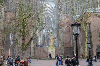 Utrecht, the Netherlands - February 13, 2016: People walking near St. Martins Cathedral in the historic city centre