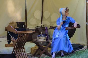 Villa Sorra, Italy - July 17, 2016: Woman in vintage dress and hat on Napoleonica event. Castelfranco Emilia, Modena