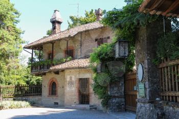 Grazzano Visconti, Italy - August 07, 2016: Old building with wooden balcony in medieval castle