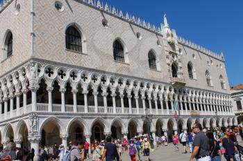 Venice, Italy - August 13, 2016: Tourists walking on famous St. Mark's Square near Doge's Palace