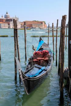 Venice, Italy - August 13, 2016: Empty gondola at the pier