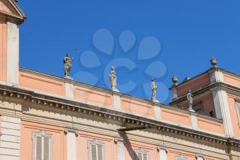Antique statues on facade of Governor Palace in Piacenza, Italy
