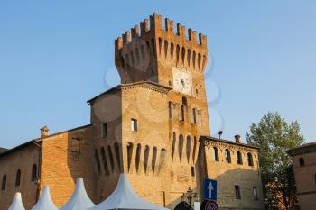 Impressive ancient fortress with clock tower in Spilamberto, Italy
