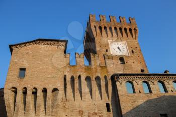 Impressive ancient fortress with clock tower in Spilamberto, Italy