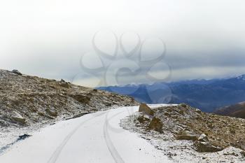 Royalty Free Photo of a Snow Covered Road in the Mountains