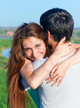 joy and sensuality in the relationship of the couple of young people outdoors