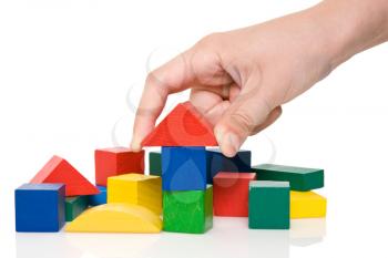 Royalty Free Photo of a Person Playing With Wooden Blocks