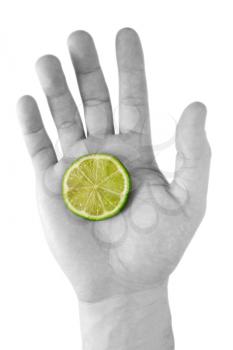 Royalty Free Photo of a Person Holding a Lemon