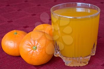 Royalty Free Photo of Mandarins and a Glass of Juice
