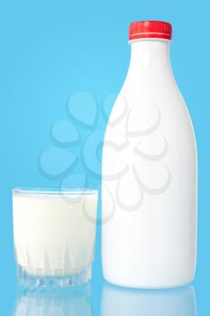 Bottle and glass of fresh milk  on blue background