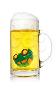Car in a mug of beer close up with a don't drink and drive concept 