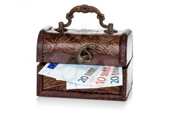 Wooden chest with Euro currency inside. Isolated on white background