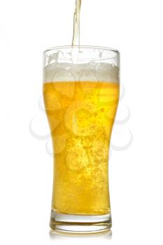 Cold beer pouring into glass. Isolated on white background
