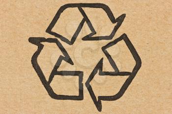  recycle symbol printed on a recycled cardboard 