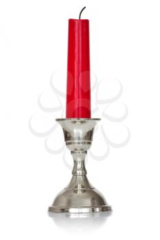 silver plated candlestick  with red candle  on white background