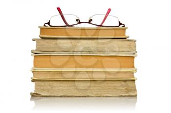 stack of books with glasses  on a white background
