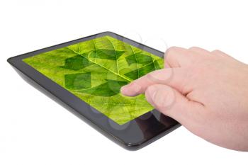 Finger touching a tablet computer with recycle symbol in the middle. Isolated on white background.