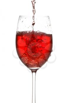 wine pouring into wineglass. isolated on white background