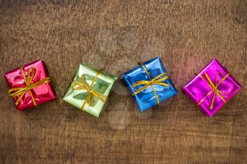 Little  gift boxes on the wooden background