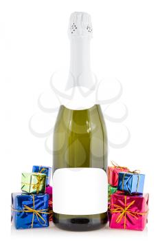 Champagne bottle and colorful gift boxes on the white background