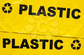 Background of yellow garbage bags for recyclable plastic
