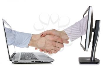 Two computers  and hands in handshaking, internet working concept, wireless communication, on-line business