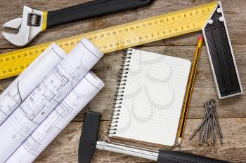 Twisted technical drawing and tools with blank notebook for your text 