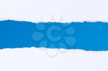 	Torn white paper with a blue background for your text.