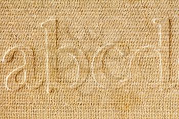 Alphabet printed on a background of  old paper,extreme close-up