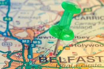 Green pushpin on the Northern Ireland map showing Belfast location